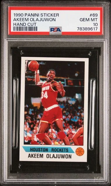 1990-91 Panini Akeem Olajuwon Sticker Hand Cut #69 card image