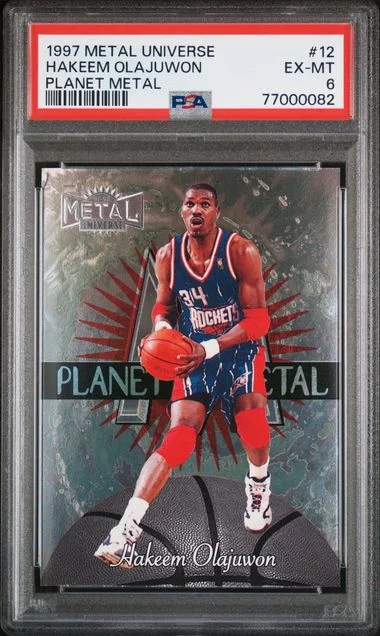 1997 Metal Universe Hakeem Olajuwon Planet Metal #12 card image
