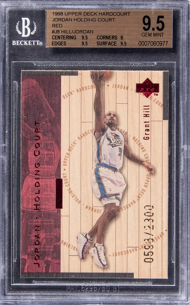 1998-99 Upper Deck Grant Hill/Michael Jordan Hard Court Jordan Holding Court Red #J8 card image
