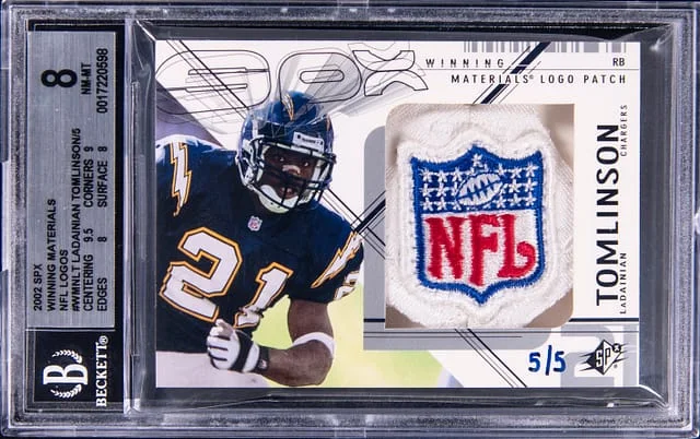 2002 Upper Deck SPx LaDainian Tomlinson NFL Shield Winning Materials NFL Logos #WMN-LT card image