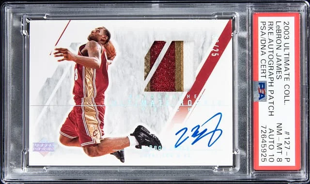 2003-04 Upper Deck Ultimate Collection LeBron James Patch Autograph (RPA) Limited #127-P card image