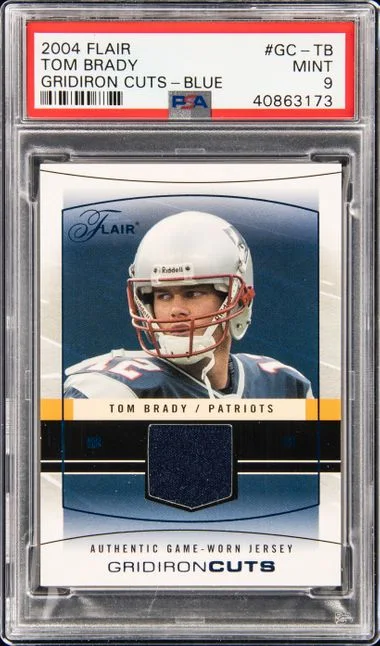 2004 Fleer Flair Tom Brady Gridiron Cuts Blue #GC-TB card image
