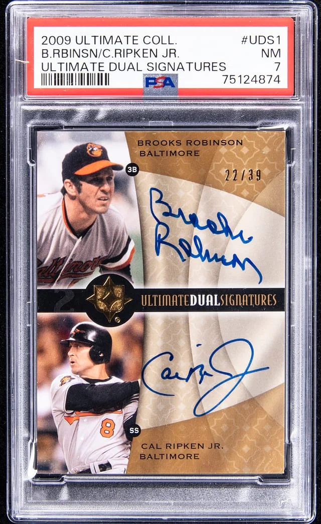 2009 UD Ultimate Collection Brooks Robinson/Cal Ripken Jr. Dual Signatures #UDS1 card image