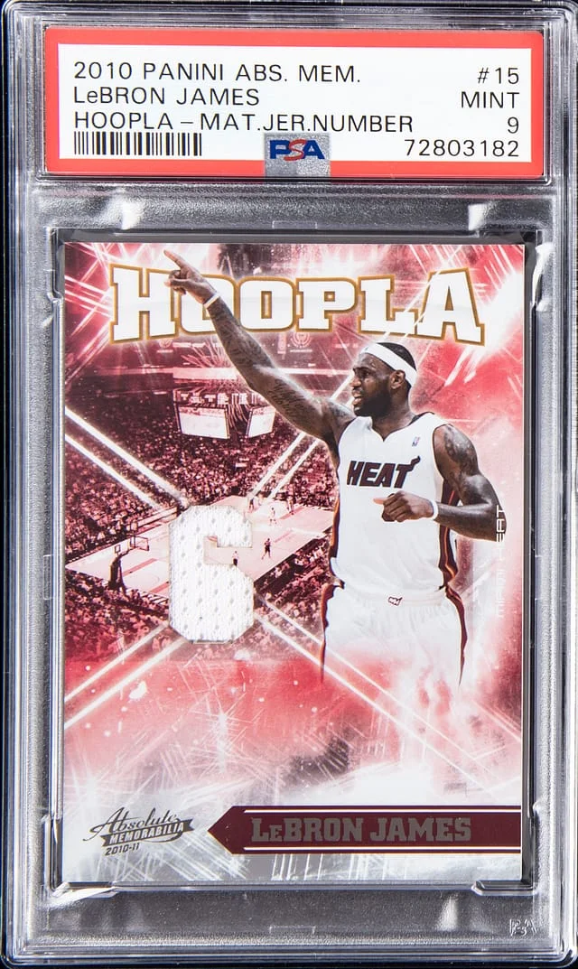 2010-11 Panini Absolute LeBron James Memorabilia Hoopla Materials Jersey Number #15 card image