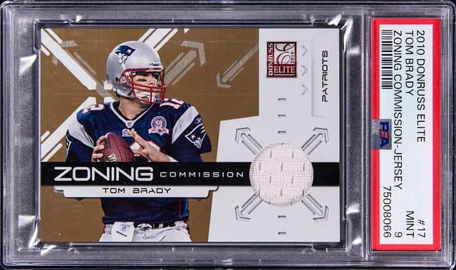 2010 Donruss Elite Tom Brady Zoning Commission Jersey #17 card image