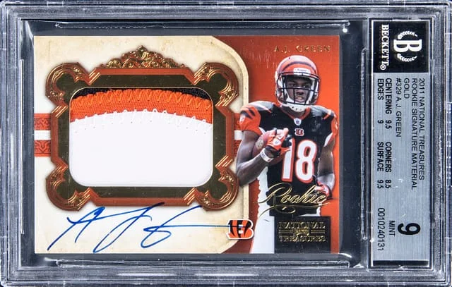 2011 Panini National Treasures A.J. Signature Material Gold #329 card image