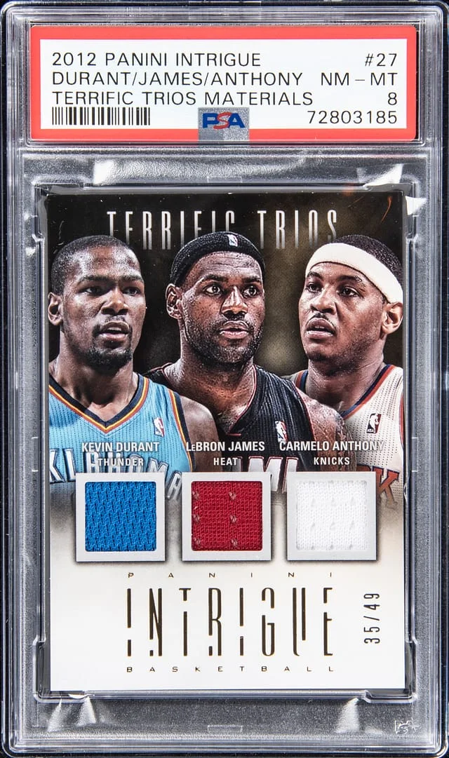 2012-13 Panini LeBron James/Kevin Durant/Carmelo Anthony Intrigue Terrific Trios Materials #27 card image