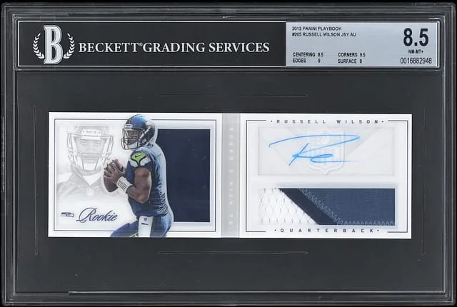 2012 Panini Russell Wilson Playbook Jersey Autograph Booklets #205 card image