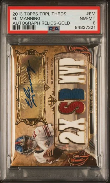 2013 Topps Triple Threads Eli Manning Autograph Relics Gold #EM card image