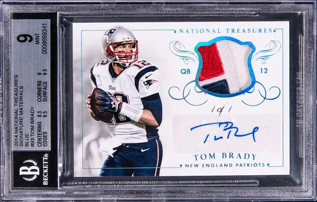 2014 Panini National Treasures Tom Brady Signature Materials Blue #MS-TB card image