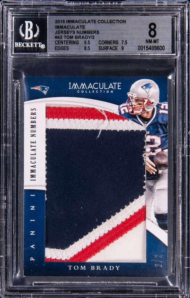 2015 Panini Immaculate Collection Tom Brady Immaculate Jersey Numbers #IJ-TB card image