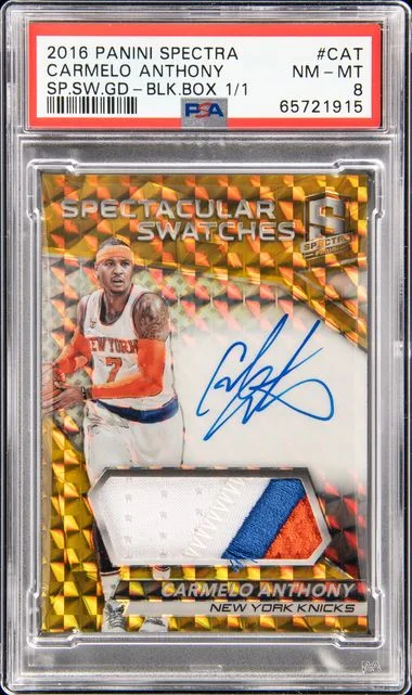 2016 Panini Spectra Cat Carmelo Anthony Spectacular Swatches Spectacular Swatches-Gold-Black Box #1/1 card image