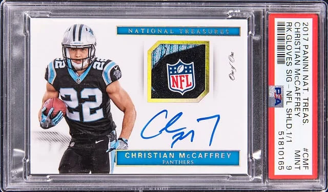 2017 Panini National Treasures Christian McCaffrey Gloves Signatures NFL Shield #RG-CMF card image