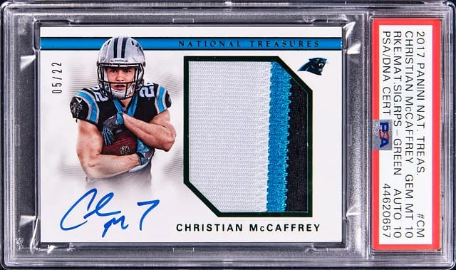 2017 Panini National Treasures Christian McCaffrey Material Signatures RPS Green #RMS-CM card image
