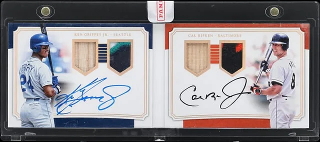 2017 Panini National Treasures Ken Griffey Jr./Cal Ripken Jr. Signature Dual Material Booklet Holo Gold #SDMB-GR card image