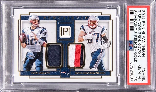 2017 Panini Tom Brady, Rob Gronkowski Dual Pantheon Sympaiktis Relics Gold #S-NE card image