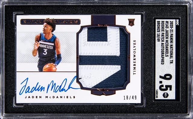 2020-21 Panini National Treasures Jaden McDaniels Patch Autograph (RPA) Bronze #143 card image