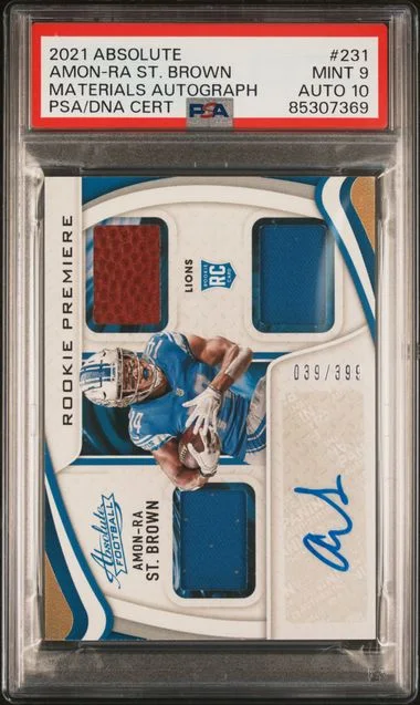 2021 Panini Absolute Amon-Ra St. Brown Materials Autograph #231 card image