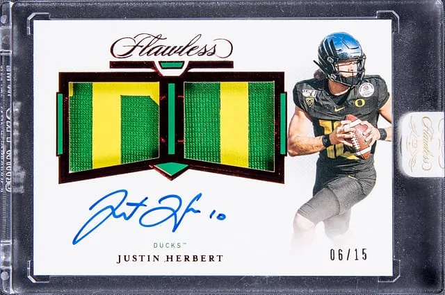 2021 Panini Flawless Justin Herbert Collegiate Dual Patch Autographs Ruby #JH card image