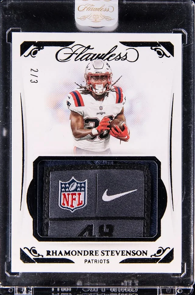 2021 Panini Flawless Rhamondre Stevenson Relic - Panini Encased Tags #SYM-RST card image