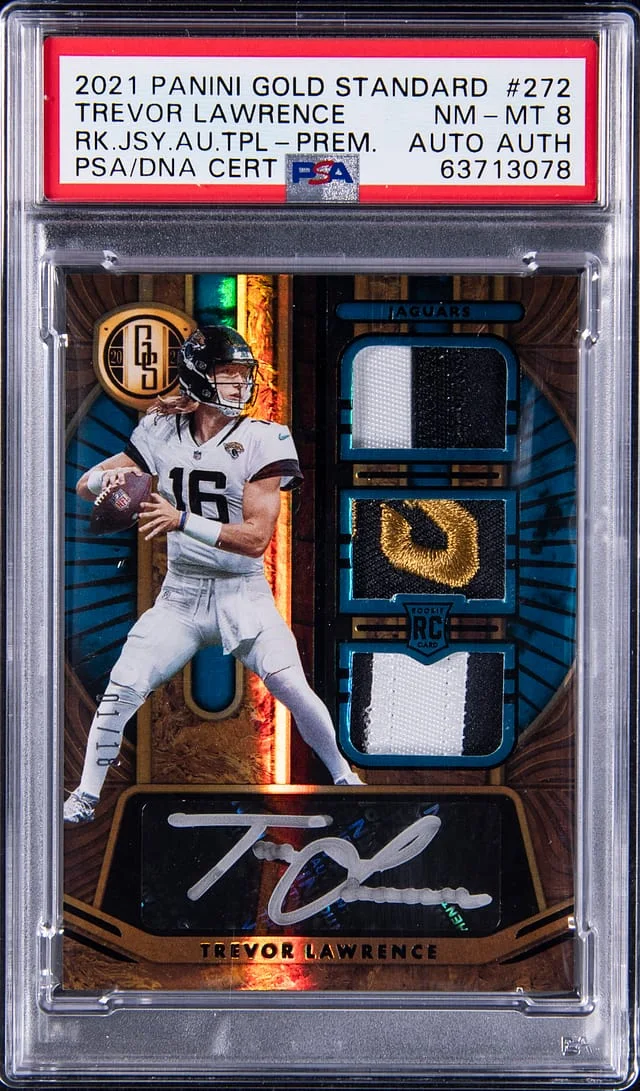 2021 Panini Gold Standard Trevor Lawrence Jersey Autograph Triple Premium #272 card image