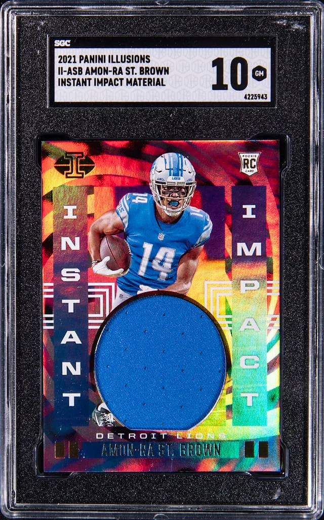 2021 Panini Illusions Amon-Ra St. Brown Instant Impact Material #II-ASB card image