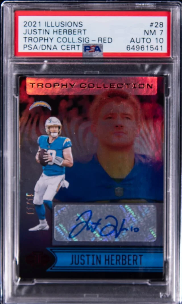 2021 Panini Illusions Justin Herbert Trophy Collection Signature Red #28 card image