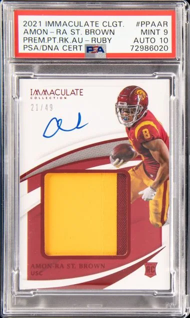 2021 Panini Immaculate Collection Amon-Ra St. Brown Collegiate Premium Patches Autographs Ruby (RPA) #PPA-AR card image
