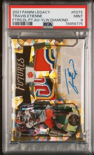 2021 Panini Legacy Futures Dual Patch Autographs Yellow Diamond Fdte Travis Etienne #no-number card image