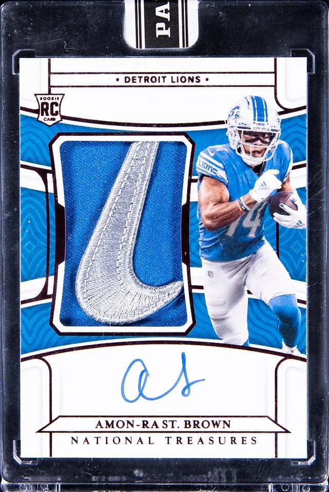 2021 Panini National Treasures Amon-Ra St. Brown Patch Autograph (RPA) #183 card image