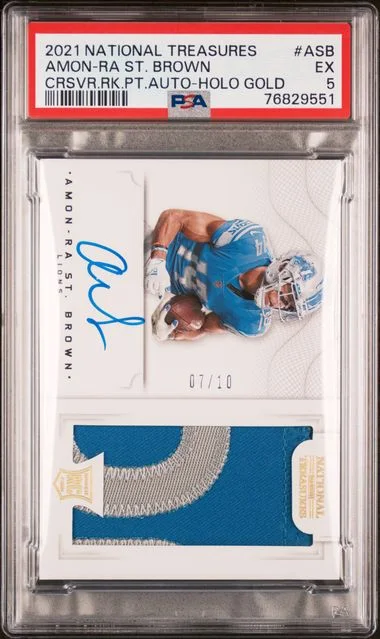 2021 Panini National Treasures Crossover Patch Autographs Holo Gold Asb Amon-Ra St. Brown #no-number card image