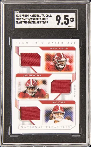 2021 Panini National Treasures DeVonta Smith/Jaylen Waddle/Mac Jones Collegiate Team Trio Materials #TTM-2 card image