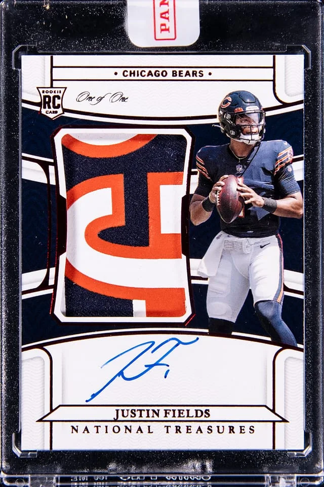 2021 Panini National Treasures Justin Fields Patch Autograph (RPA) Red #159 card image