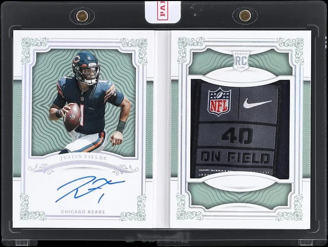 2021 Panini National Treasures Justin Fields First Edition Signatures Booklet Silver #RFE-JF card image