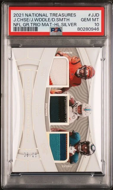 2021 Panini National Treasures NFL Gear Trio Materials Holo Silver Jjd Devonta Smith/Ja'Marr Chase/Jaylen Waddle #no-number card image
