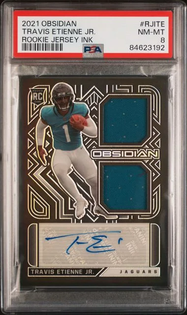 2021 Panini Obsidian Travis Etienne Jr. Jersey Ink #RJITE card image