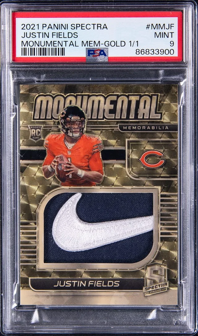 2021 Panini Spectra Justin Fields Monumental Memorabilia Gold Vinyl #MMJF card image