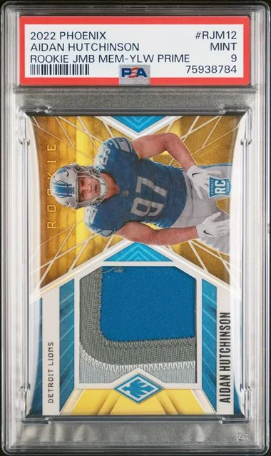 2022 Panini Aidan Hutchinson Phoenix Jumbo Memorabilia Yellow Prime #RJM12 card image