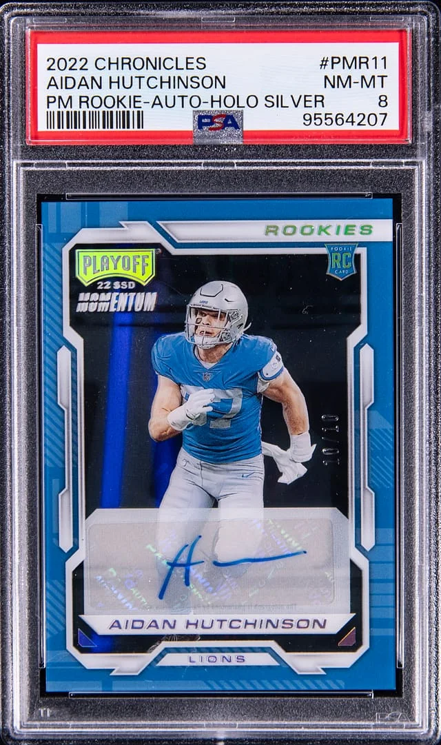 2022 Panini Chronicles Aidan Hutchinson Playoff Momentum Autograph Holo Silver #PMR11 card image