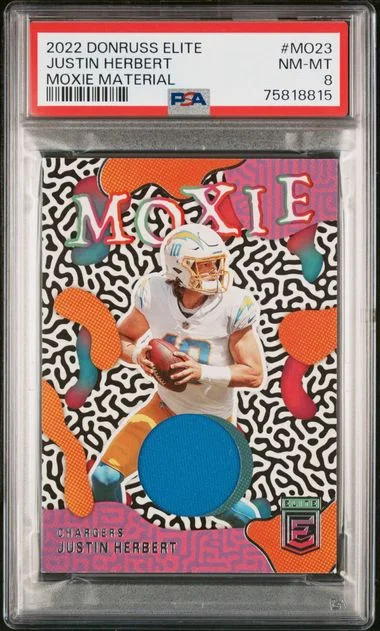 2022 Panini Donruss Justin Herbert Elite Moxie Materials #MO23 card image