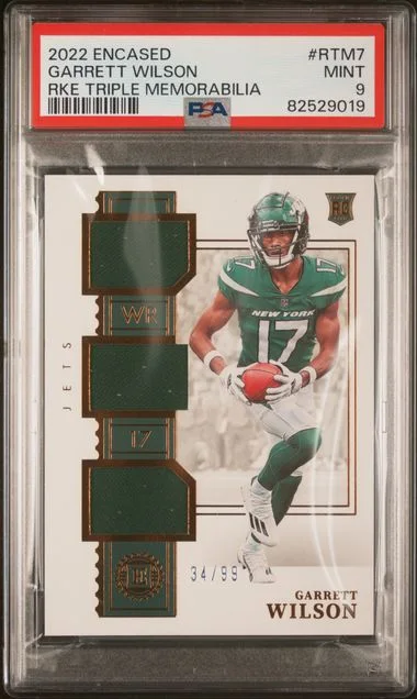 2022 Panini Encased Garrett Wilson Triple Memorabilia #Rtm7 card image
