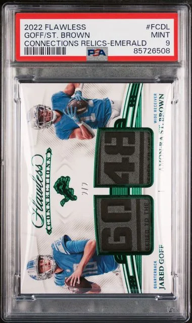 2022 Panini Flawless Amon-Ra St. Brown/Jared Goff Game-Used Connections Relics Emerald #FCDL card image