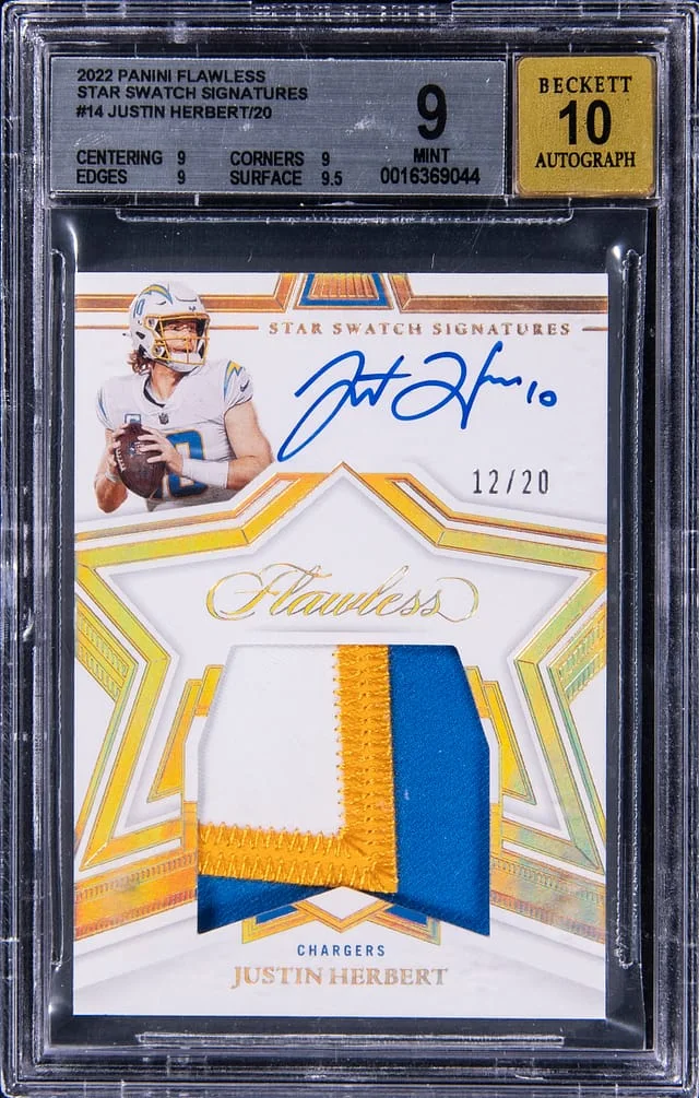 2022 Panini Flawless Justin Herbert Star Swatch Signatures #14 card image