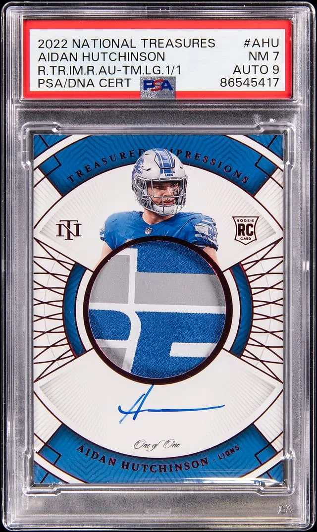 2022 Panini National Treasures Aidan Hutchinson Treasured Impression Relic Autograph Team Logo #TI-AHU card image
