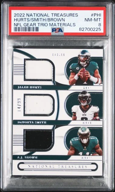 2022 Panini National Treasures A.J. Brown/Devonta Smith/Jalen Hurts NFL Gear Trio Materials #PHI card image