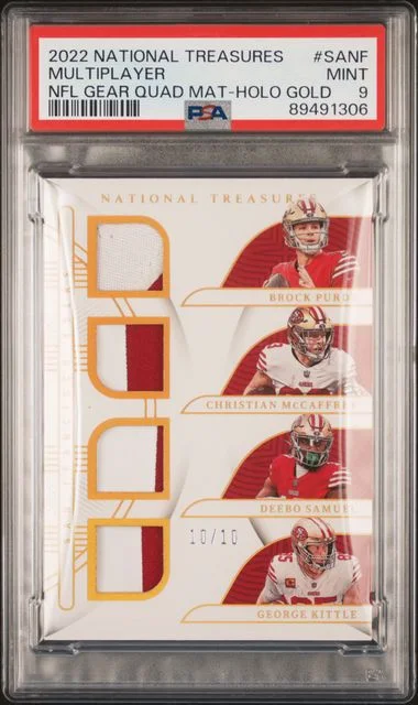 2022 Panini National Treasures B.Purdy /C.McCaffrey/D.Samuel/G.Kittle NFL Gear Quad Materials Holo Gold #SANF card image