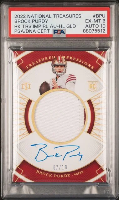 2022 Panini National Treasures Brock Purdy Treasured Impressions Relic Autograph Holo Gold #BPU card image