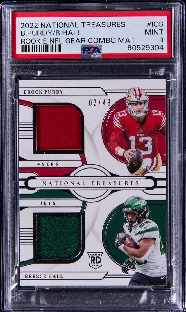 2022 Panini National Treasures Brock Purdy/Breece Hall NFL Gear Combo Materials #IOS card image