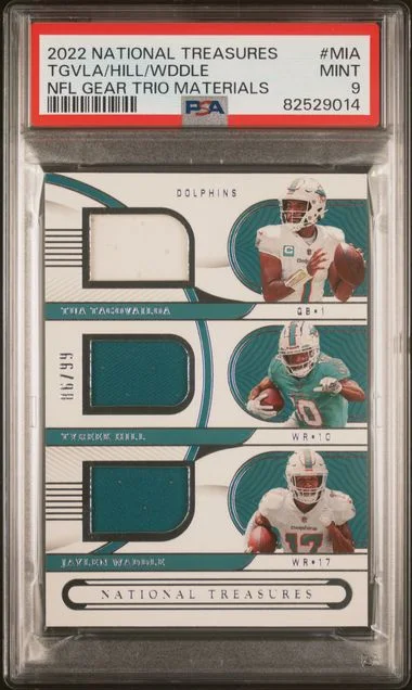 2022 Panini National Treasures Jaylen Waddle/Tua Tagovailoa/Tyreek Hill NFL Gear Trio Materials #MIA card image