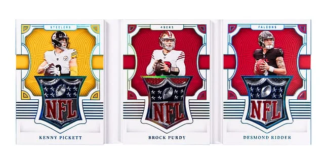 2022 Panini National Treasures Kenny Pickett/Brock Purdy/Desmond Ridder NFL Shield Triple Booklet NFL Shield #RTB-QB card image